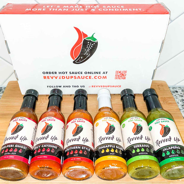 Unleash your inner daredevil with our six original hot sauces. All six. Jalapeno hot sauce. Serrano hot sauce. Pineapple Bomb hot sauce. Southern Style hot sauce. Spicy cayenne hot sauce. Peri peri ghost. Free shipping. Black background Let&