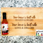 Spicy Cayenne Bomb Hot Sauce - | Revved Up. Your house is built with boards and beams. Your home is built with love and dreams. Cutting board design with hot sauce on it. 