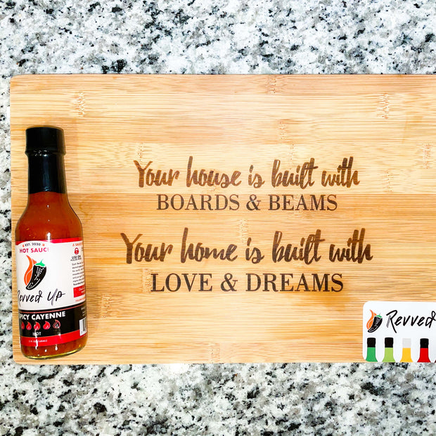 Spicy Cayenne Bomb Hot Sauce - | Revved Up. Your house is built with boards and beams. Your home is built with love and dreams. Cutting board design with hot sauce on it. 